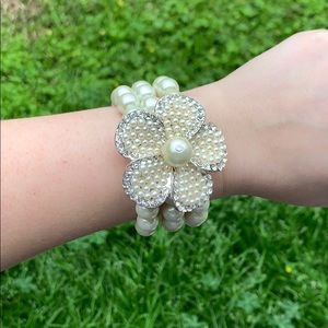 Triple pearl bracelet with flower pendant corsage
